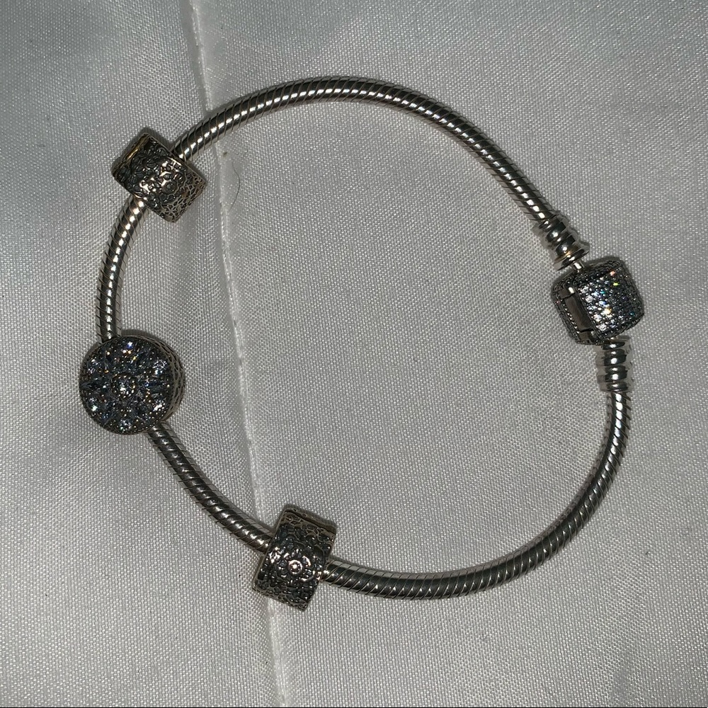 Authentic Pandora charm bracelet with three charms